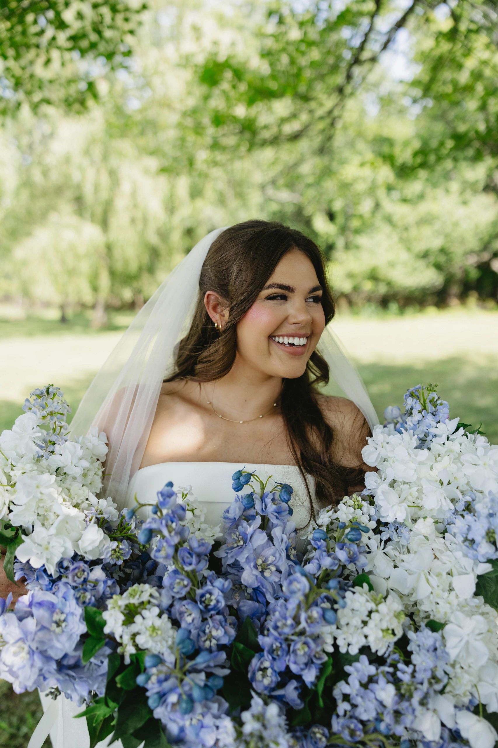 Bride in white wedding dress with flowers